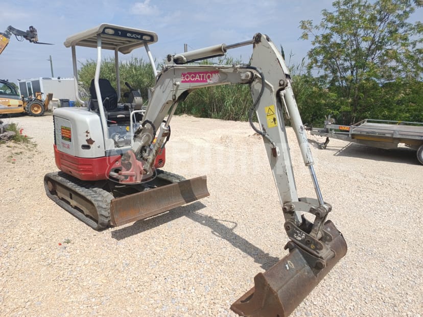 Picture of the Takeuchi TB23R with 3 excavator buckets